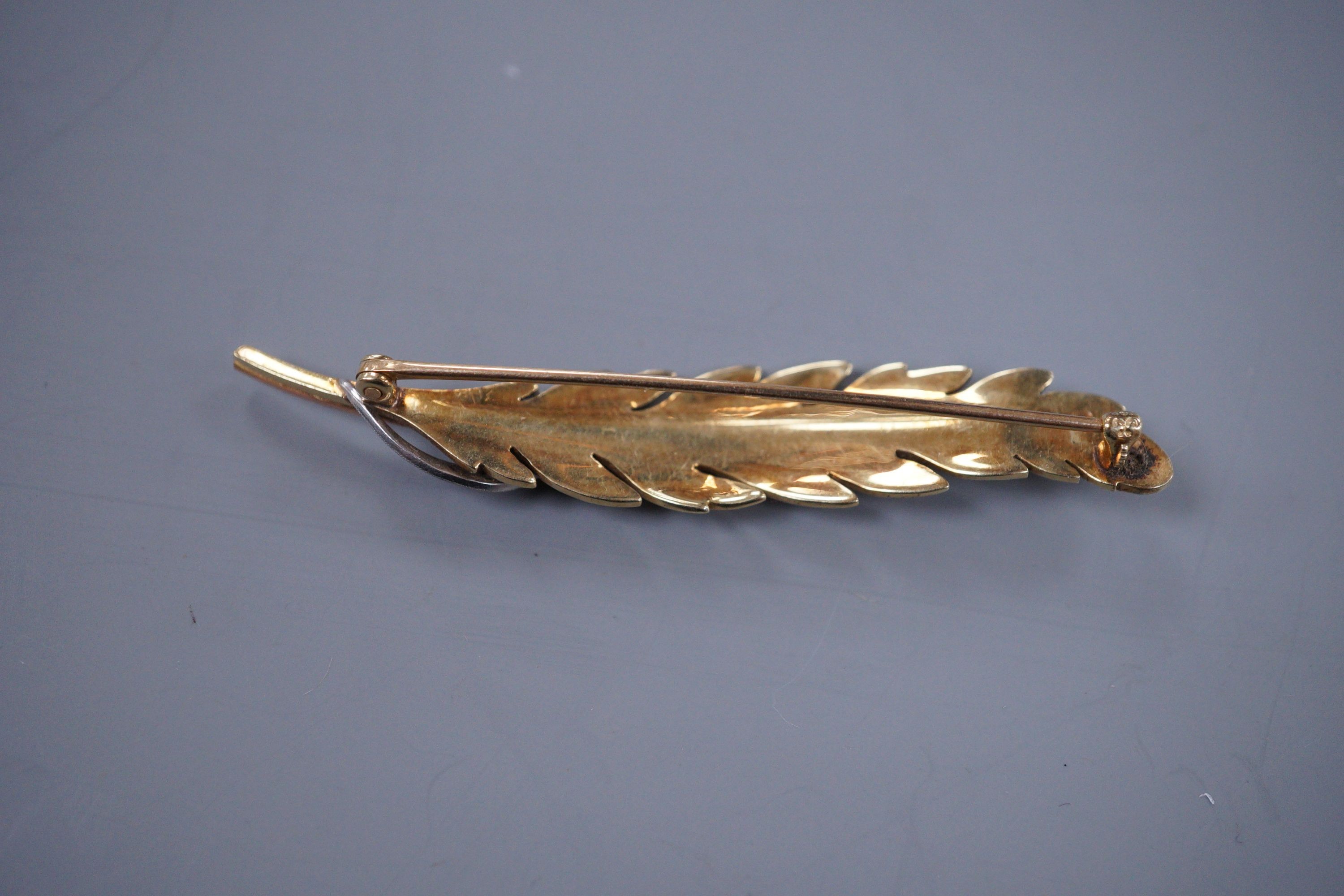 A 1940's Continental two colour gold and diamond feather bar brooch, 6.25cm. gross 7.6 grams